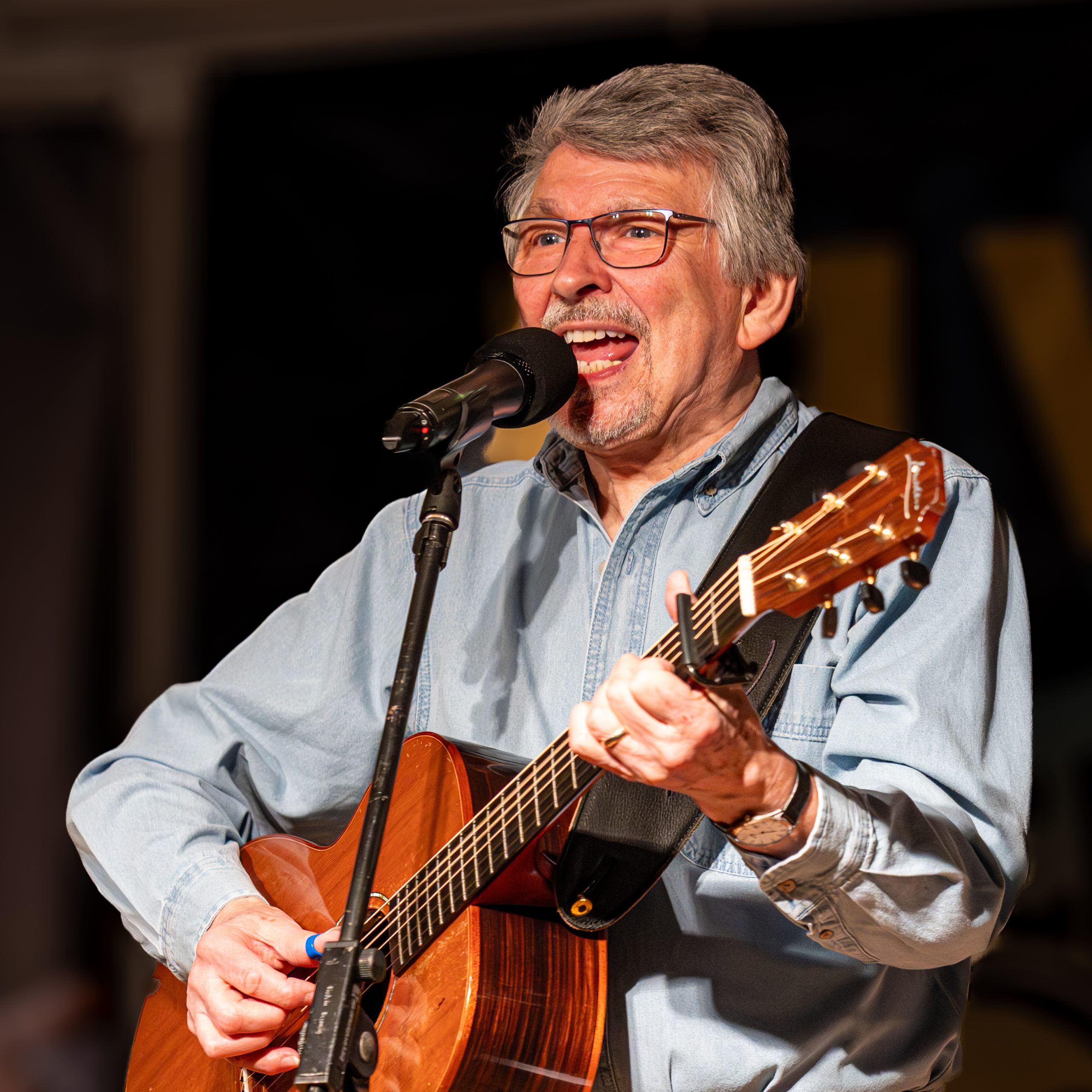 Image of Bruce playing his guitar